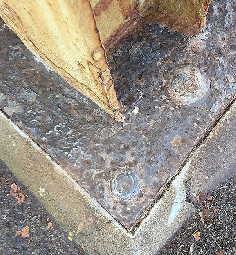 Completed surface preparation of base of structural steel column