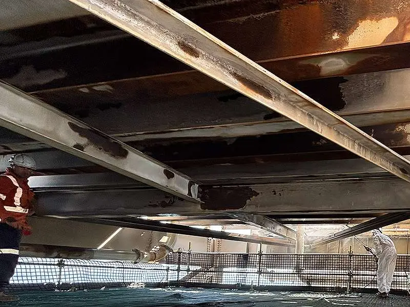 Corroded water tank steel supports in need of repair and coating