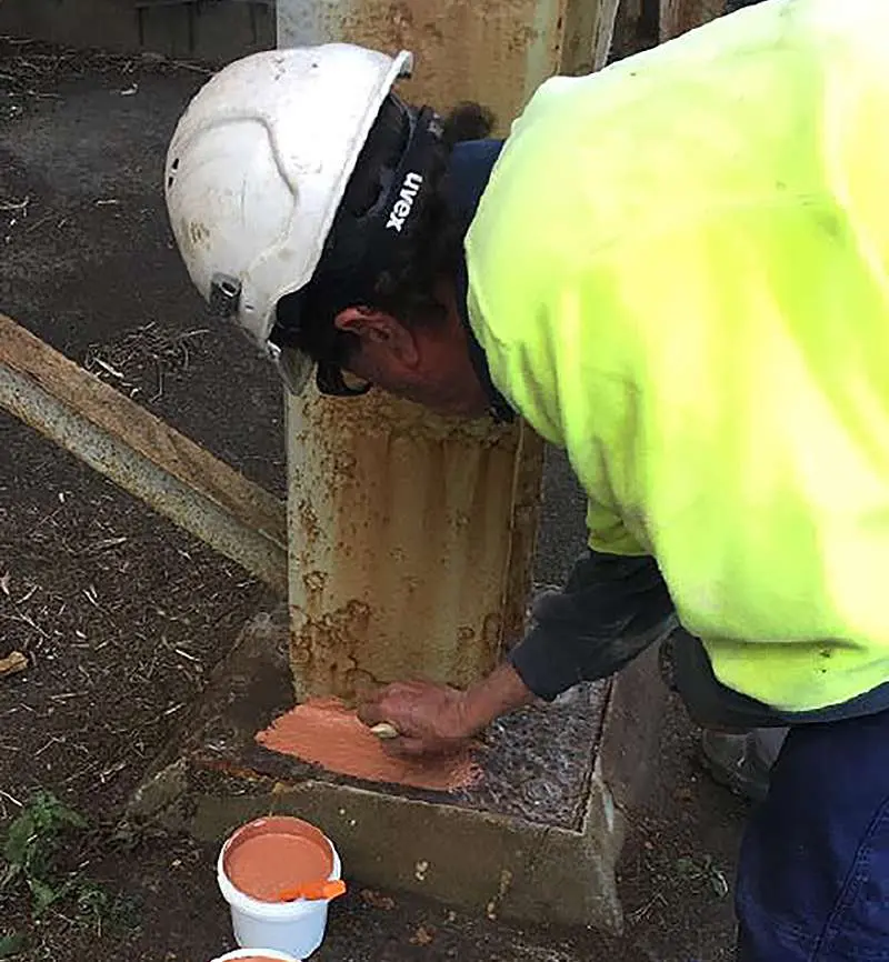 NanoPrep applied by brush to corroded base of steel column substrate