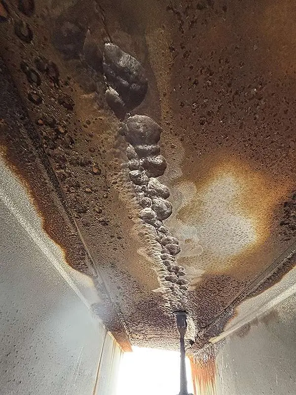 Water tank underside pitting caused by corrosion
