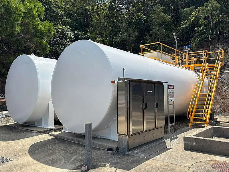 The above-ground diesel storage tanks in their coastal Queensland setting